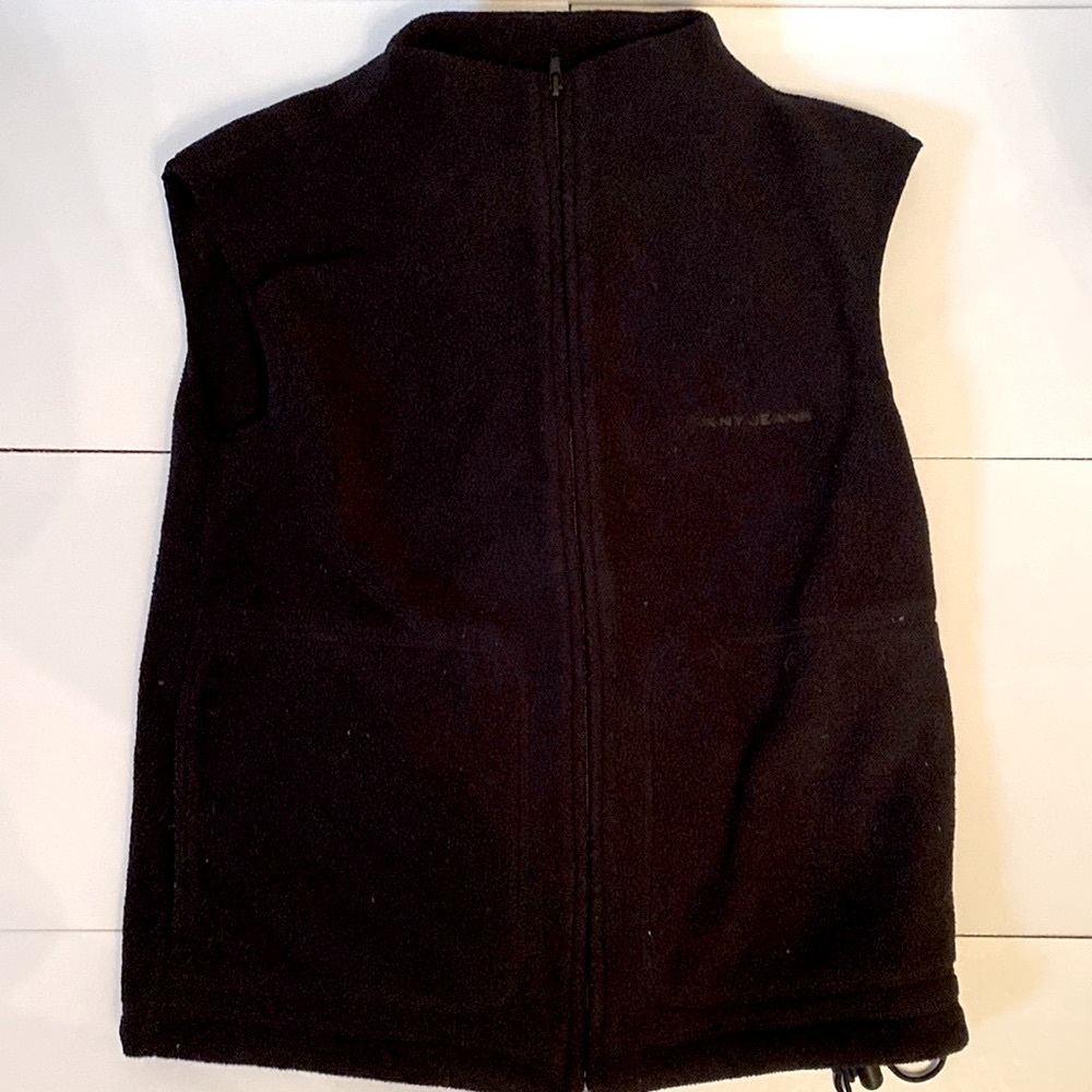 DKNY black polyester fleece vest. Zippered front. Drawstring bottom. Size XS.